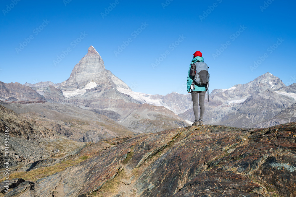 Hiker in front of Matterhorn mountain, Swiss Alps, Zermatt, Switzerland