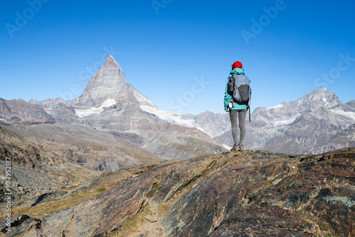 Obraz na płótnie Hiker in front of Matterhorn mountain, Swiss Alps, Zermatt, Switzerland w salonie