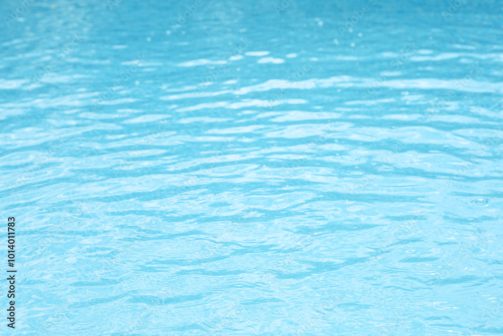 Clear water in outdoor swimming pool on sunny day Clear water in outdoor swimming pool on sunny day