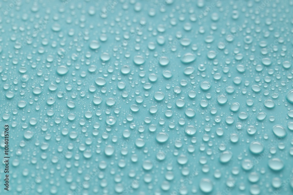 Water drops on turquoise background, above view Water drops on turquoise background, above view