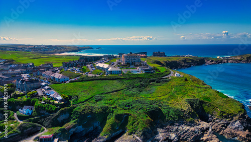 Aerial View of Coastal Town with Ocean and Green Hills at Towan Beach, Newquay, Cornwall. photo