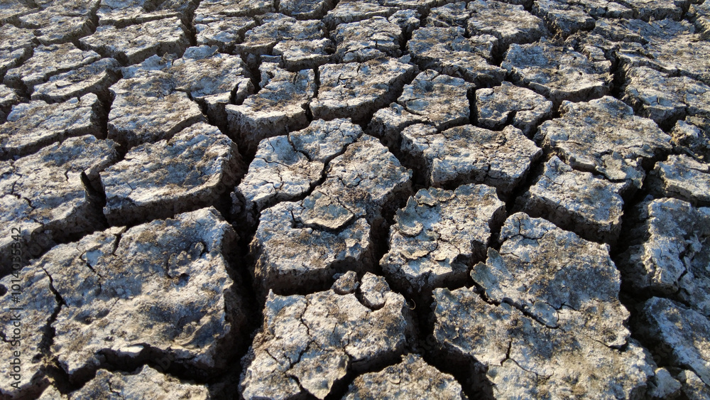 broken and cracked lands caused by drought, lands split open by thirst,