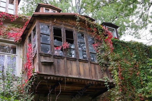 Old wooden Jewish sukkah next to a building in Plock in autumn.