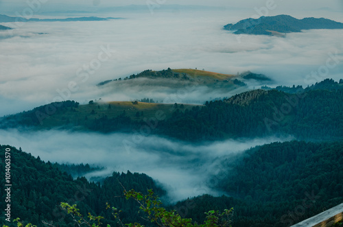 Mountain Peaks Above the Clouds at Dawn photo