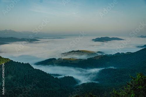 Mountain Peaks Above the Clouds at Dawn photo