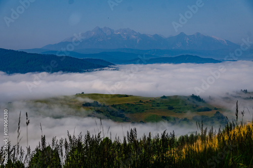 Mountain Peaks Above the Clouds at Dawn photo