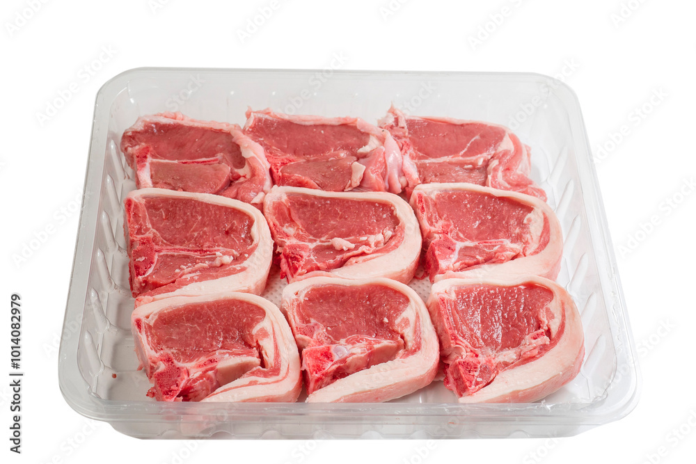 Nine fresh lamb loin chops on a plastic tray. High quality meat product on the bone cut by butcher in perfect size for cooking. Food supply chain and agriculture industry. White background. Nine fresh lamb loin chops on a plastic tray. High quality meat product on the bone cut by butcher in perfect size for cooking. Food supply chain and agriculture industry. White background.