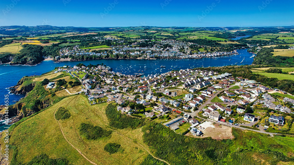 Φωτογραφία Aerial View of a Coastal Town with Harbor and Green Hills in Cornwall, UK