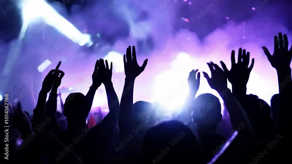 Crowd cheering and raising hands during live music concert Crowd cheering and raising hands during live music concert