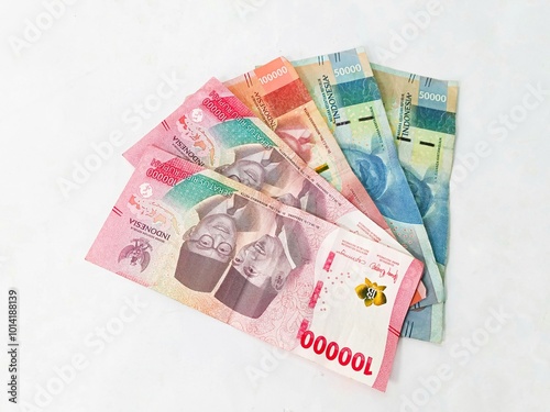 Rupiah banknotes background. Indonesian money. stack of Indonesian banknotes one hundred thousand rupiah isolated on white background. photo