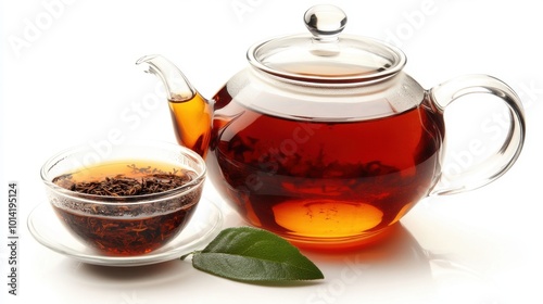 Kettle filled with ashwagandha tea, alongside a small cup for pouring, promoting relaxation and wellness