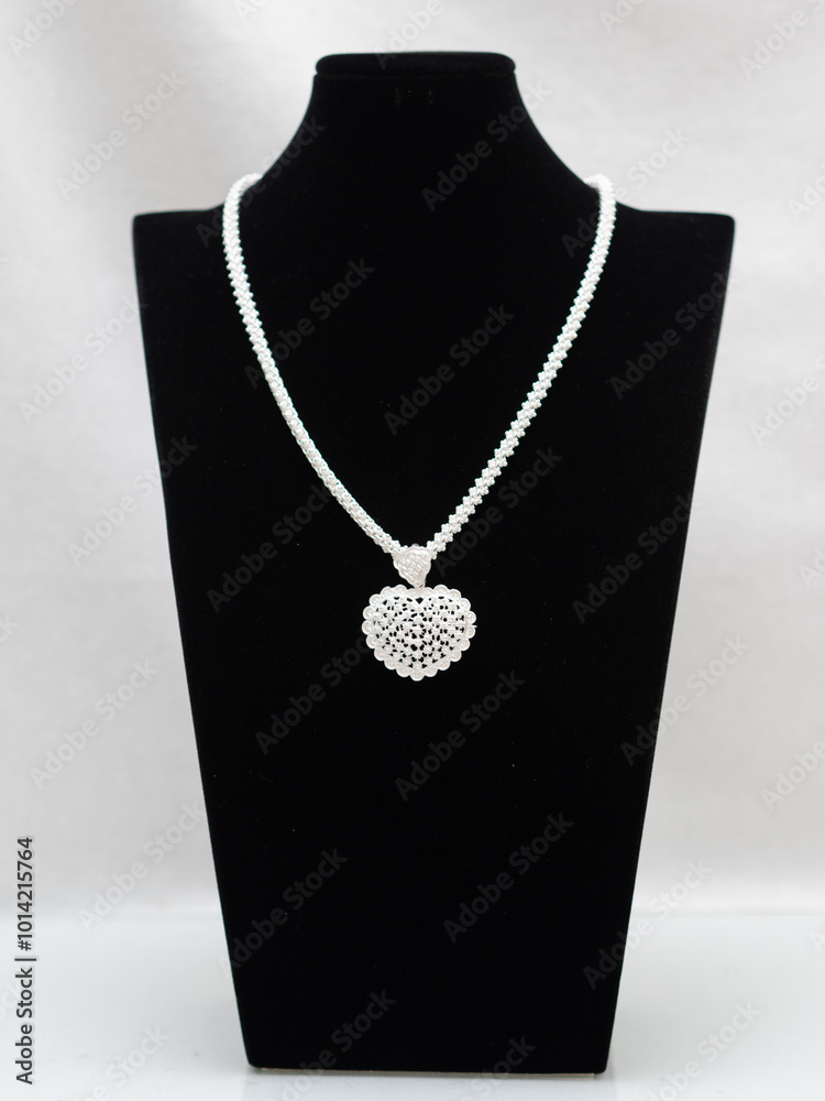 Hmong or Miao handmade silver jewelry on white background Hmong or Miao handmade silver jewelry on white background