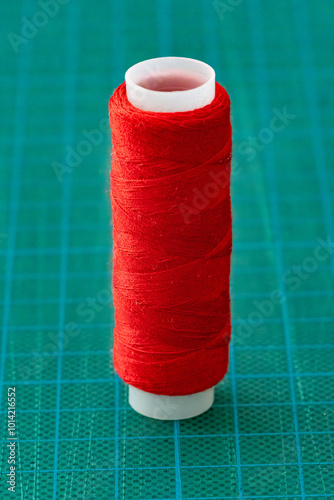 Red thread on a green background