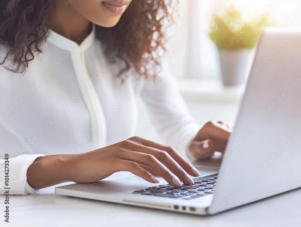 a business woman working on her laptop in a minimalist office space a business woman working on her laptop in a minimalist office space