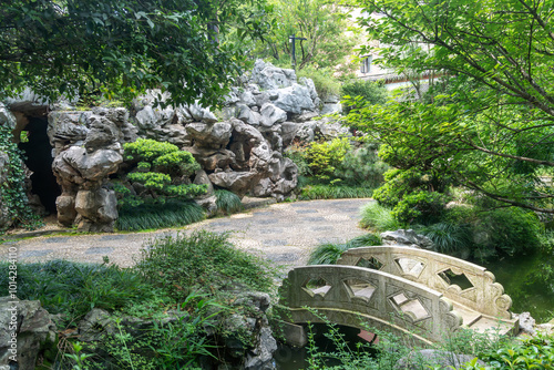 stone footbridge in an Asian garden photo