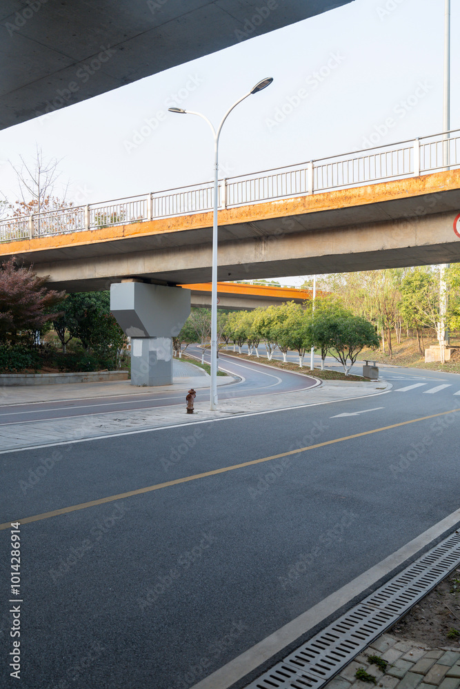 Concrete structure and asphalt road space under the overpass in the city Concrete structure and asphalt road space under the overpass in the city