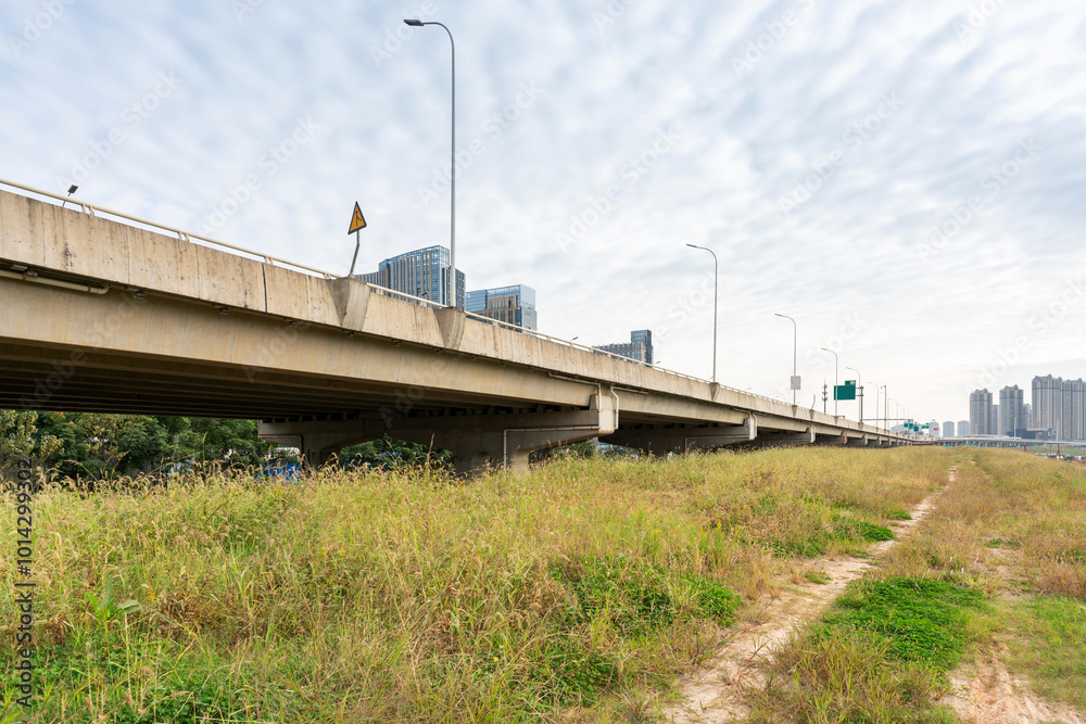Concrete structure and asphalt road space under the overpass in the city Concrete structure and asphalt road space under the overpass in the city