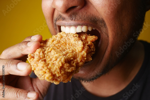 A Delicious Plate of Fried Chicken Happily Enjoyed by a Smiling Person at a Restaurant