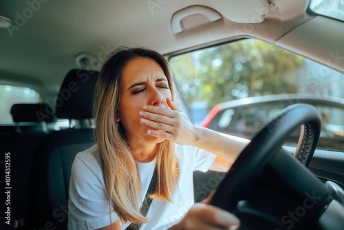 Fatigued Driver Yawning Feeling Sleepy Behind the Wheel. Exhausted woman driving all day feeling exhausted 

 photo