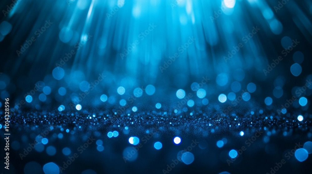 Fototapeta premium Abstract bokeh of light blue illuminations holidays background, Blue glitter scattered across a surface creating a beautiful abstract bokeh backdrop.