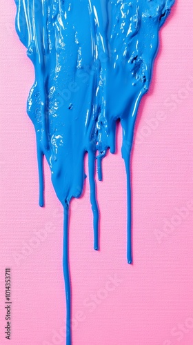 Blue paint dripping down pink canvas, vibrant abstract art. Creativity and color splash concept