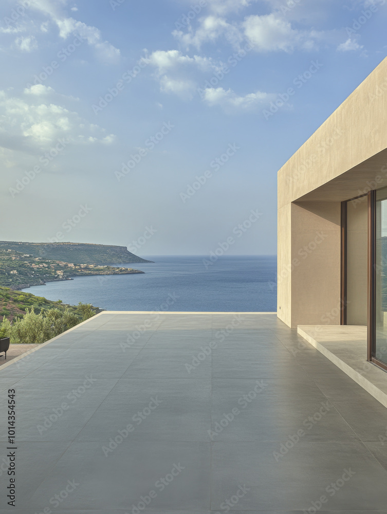 Fototapeta premium Modern terrace overlooking tranquil blue sea and hillside landscape in bright daylight