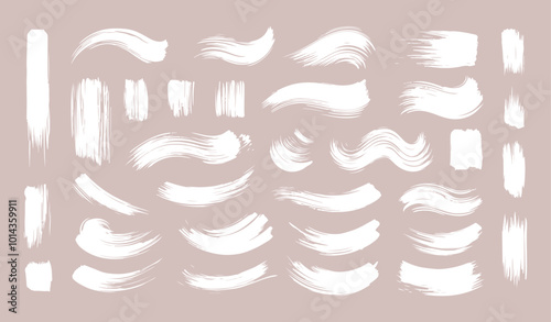 Set of Ink brush stroke silhouettes in various shapes and sizes