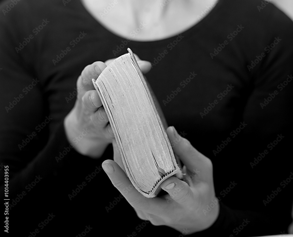 Naklejka premium praying with hand on bible learning christianity and the faith of God with people stock image stock photo 