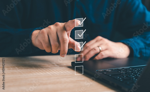 Business performance checklist, businessman using laptop doing online checklist survey, filling out digital form checklist, take an assessment, questionnaire, evaluation, online survey, online exam