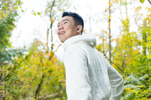 A young man walking in the woods