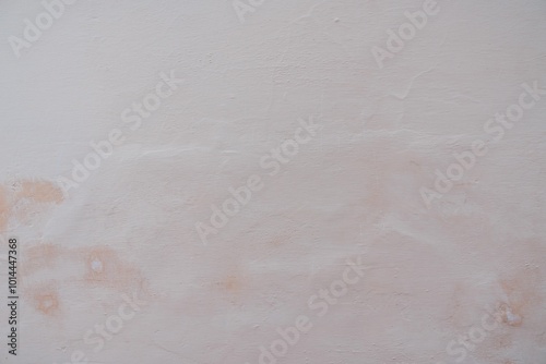 Textured Plaster Wall Background. A close-up of a textured plaster wall with an abstract rough surface. The neutral light beige color and irregular patterns create a natural and artistic backdrop. 