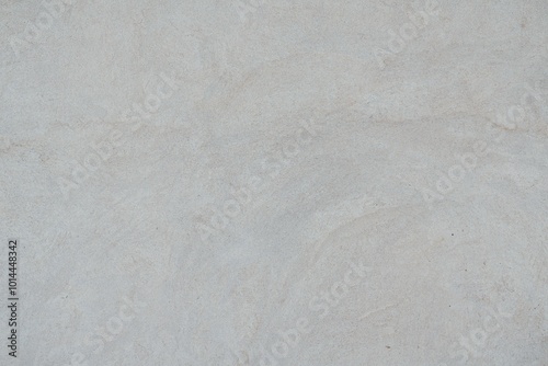 Textured Plaster Wall Background. A close-up of a textured plaster wall with an abstract rough surface. The neutral light beige color and irregular patterns create a natural and artistic backdrop. 
