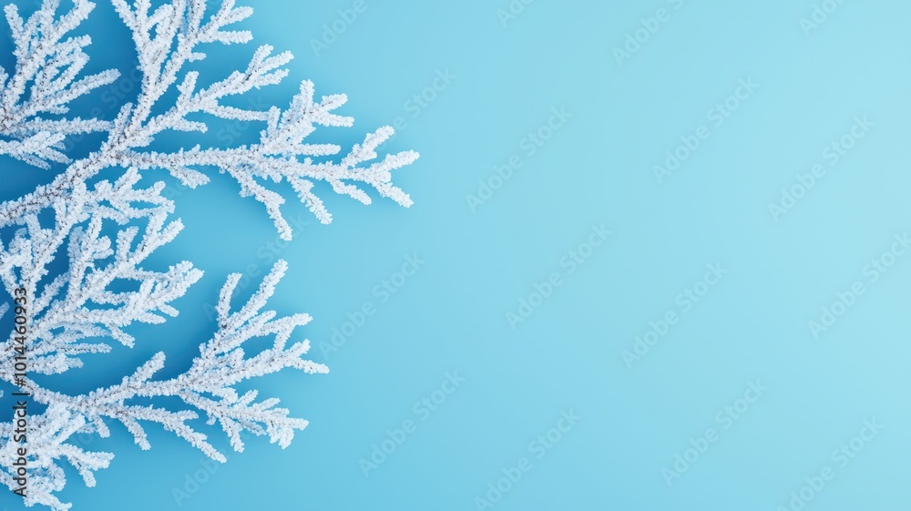 Obraz premium A delicate snowflake against a soft blue background, showcasing intricate patterns and a wintry aesthetic.