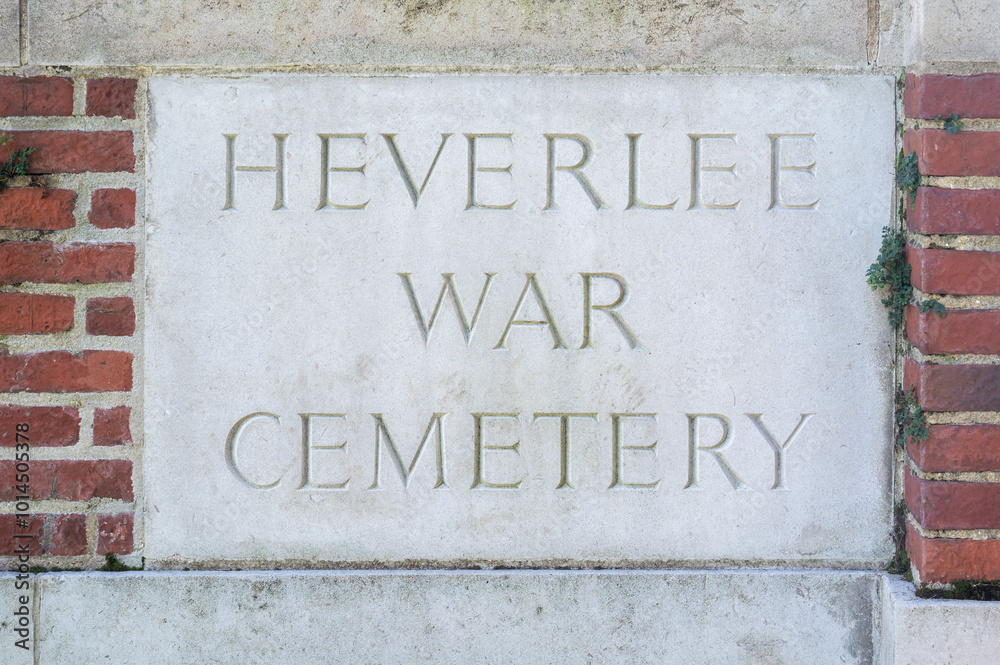 Sign of the Heverlee War Cemetery against a brick stone wall, Leuven, Flemish Brabant, Belgium, SEP 21, 2024 Sign of the Heverlee War Cemetery against a brick stone wall, Leuven, Flemish Brabant, Belgium, SEP 21, 2024