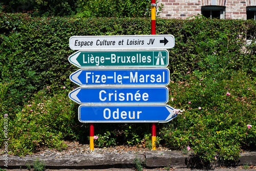 Crisnée, Wallonia, Belgium, AUG 10, 2024 - Road signs to cities and the E40 highway photo