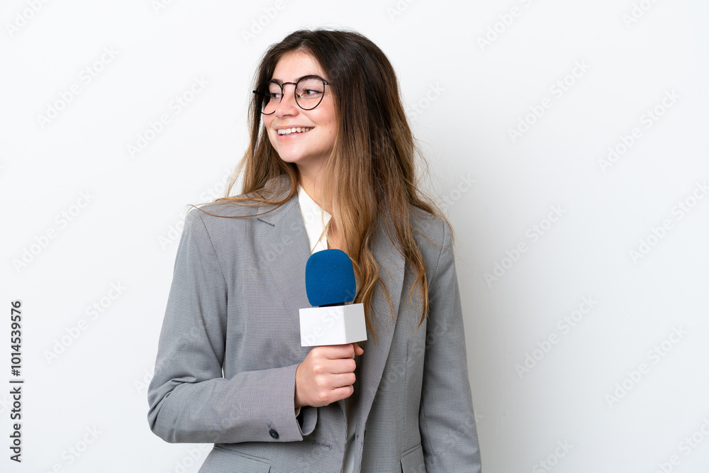 Young caucasian TV presenter woman isolated on white background looking to the side and smiling Young caucasian TV presenter woman isolated on white background looking to the side and smiling
