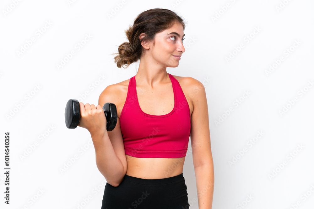 Young sport caucasian woman making weightlifting isolated on white background looking to the side Young sport caucasian woman making weightlifting isolated on white background looking to the side