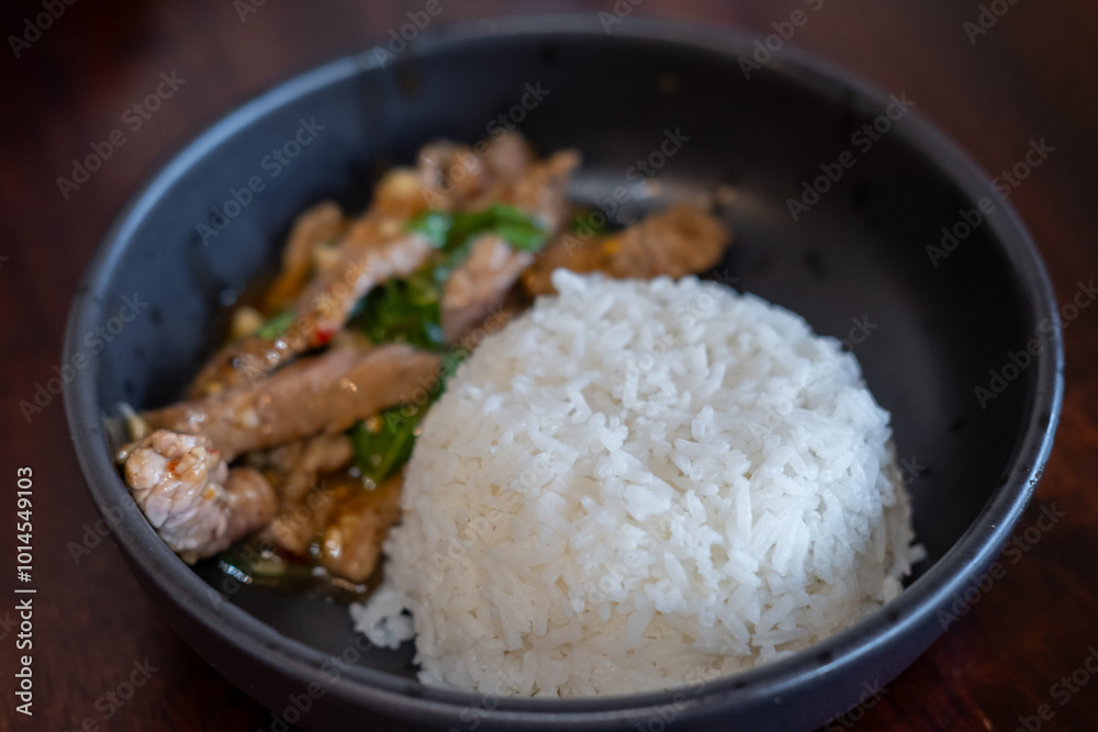 Rice with Kaprao beef served on plate. It is Thai style stir-fried holy basil with meat. Rice with Kaprao beef served on plate. It is Thai style stir-fried holy basil with meat.