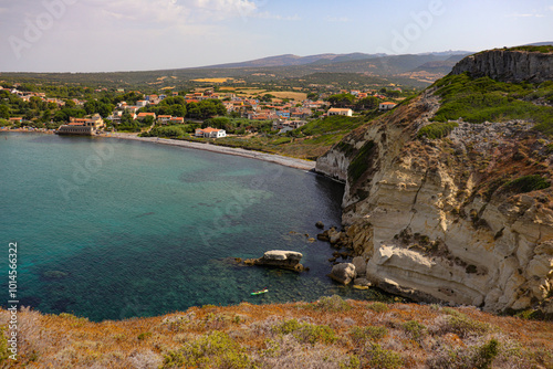 Scenic Coastal Village with Clear Waters and Cliffs photo