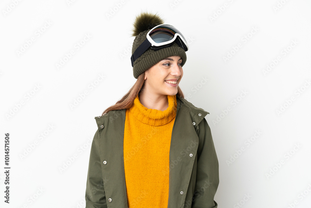 Skier caucasian woman with snowboarding glasses isolated on white background looking side Skier caucasian woman with snowboarding glasses isolated on white background looking side