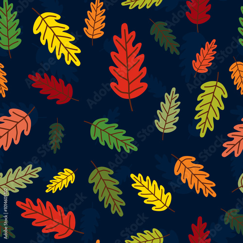 Buntleuchtende Herbstblätter auf dunkelblauem Hintergrund