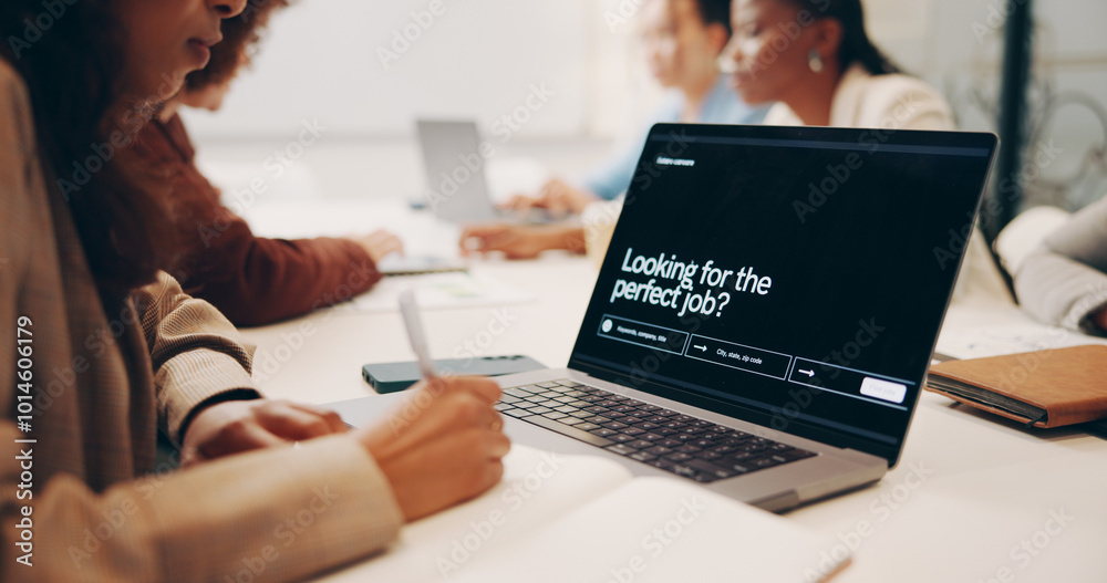 © KayExam/peopleimages.com - Woman, hands and writing with laptop screen for career search or job opportunity at office. Young, female person or intern taking notes with notebook on computer for online research, website or app