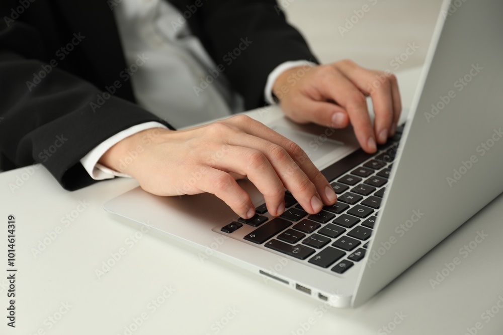 Businesswoman using laptop at white table indoors, closeup. Modern technology Businesswoman using laptop at white table indoors, closeup. Modern technology