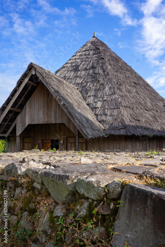 Charming Sasak house with traditional thatched roof in Lombok, Indonesia. This photograph captures the essence of Sasak architecture and culture, ideal for historical and travel content. photo