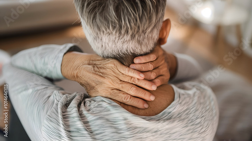 Pain in the neck muscle of an elder man. Nape pain and nuchal stiffness.