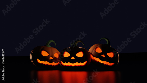 Halloween jack o lantern pumpkin on black background. The main symbol of the Happy Halloween holiday. A group of lit spooky halloween pumpkins.