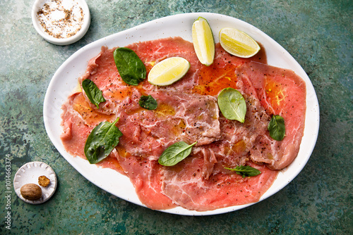 Beef carpaccio with lime and spinach