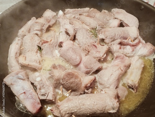 Obraz na płótnie mixed pork meat cooked in a pan with rosemary and sage, butter, oil and salt w salonie