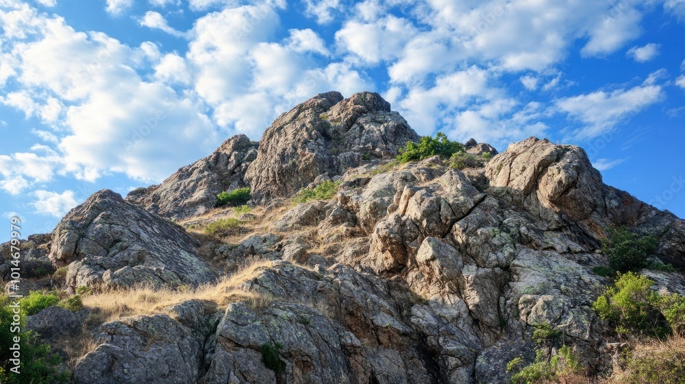 Rocky outcrop on a hilltop, with rugged terrain and sharp angles carved by nature Rocky outcrop on a hilltop, with rugged terrain and sharp angles carved by nature
