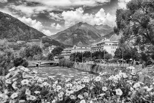 Passirio River flowing through Merano city center, South Tyrol, Italy photo